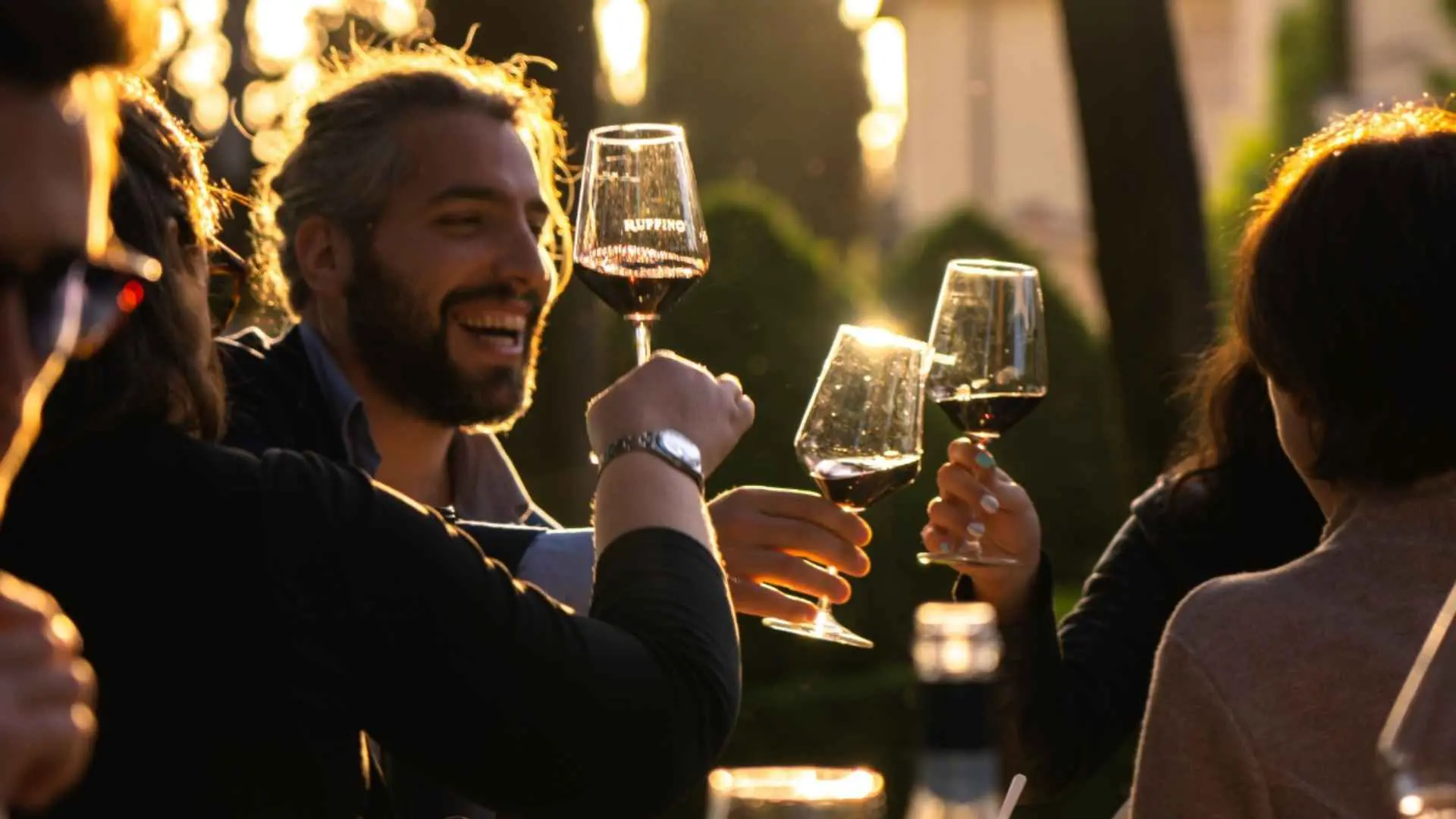 Ruffino 1877 wine tasting experience, showing people having fun and drinking red wine.