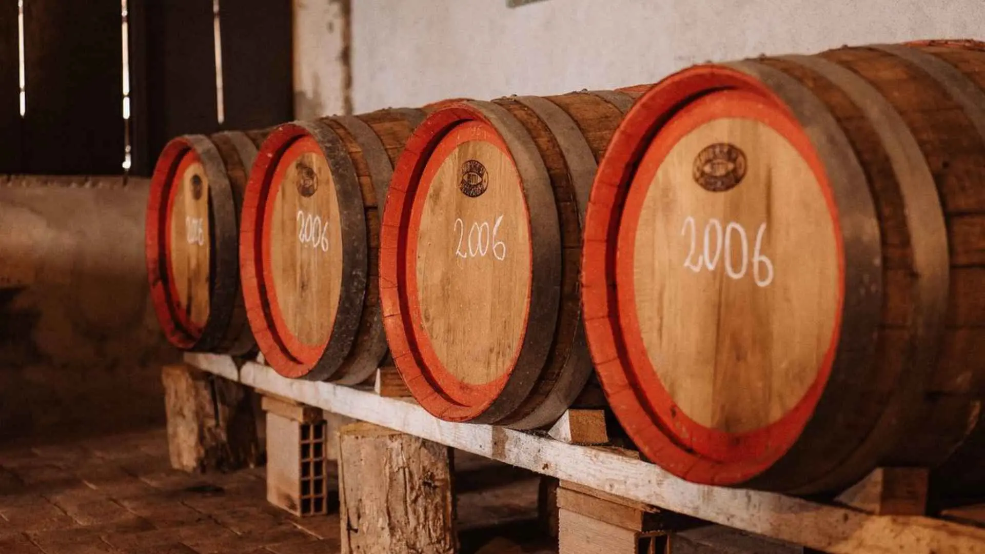 Fattoria La Torre wine barrels. There is a year written on the top of the barrels, namely 2006.