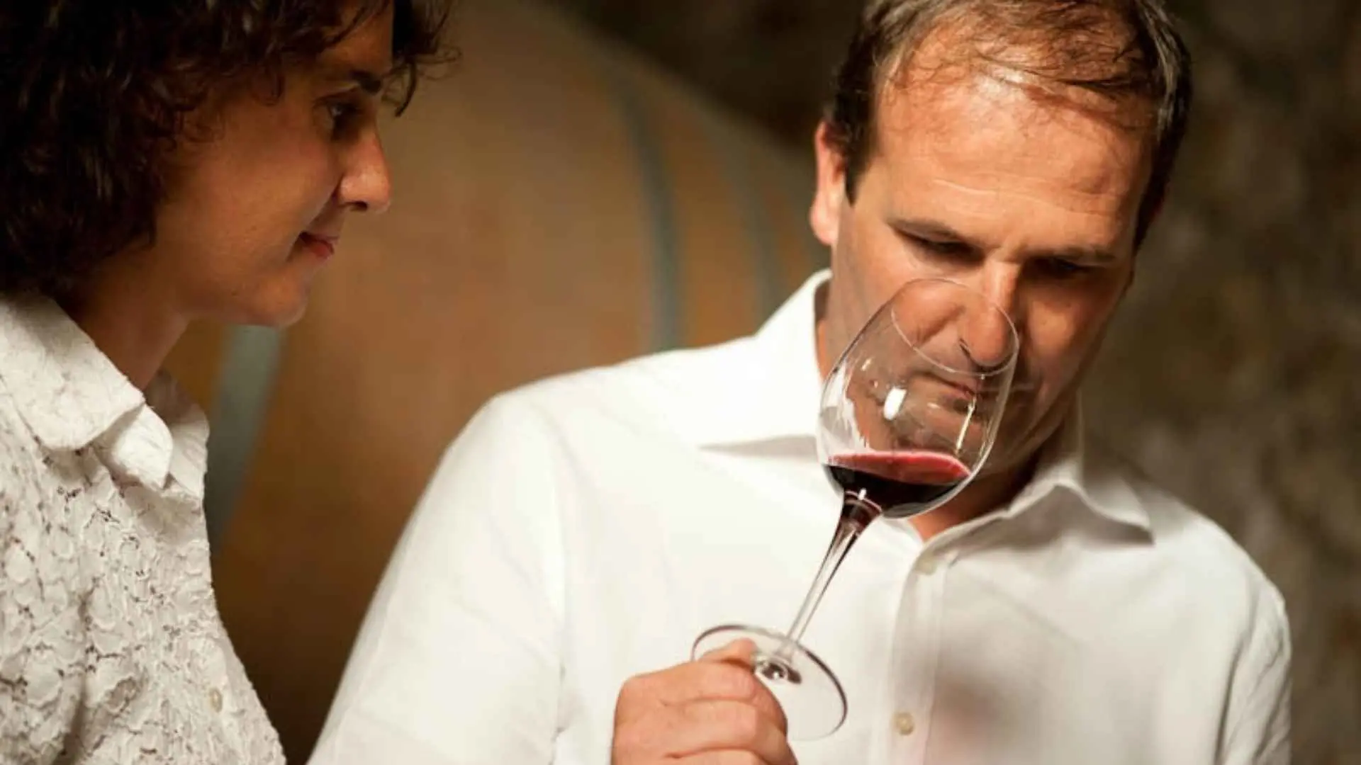 Corte Archi wine tasting experience. The image shows a man and a woman and the man is having red wine.