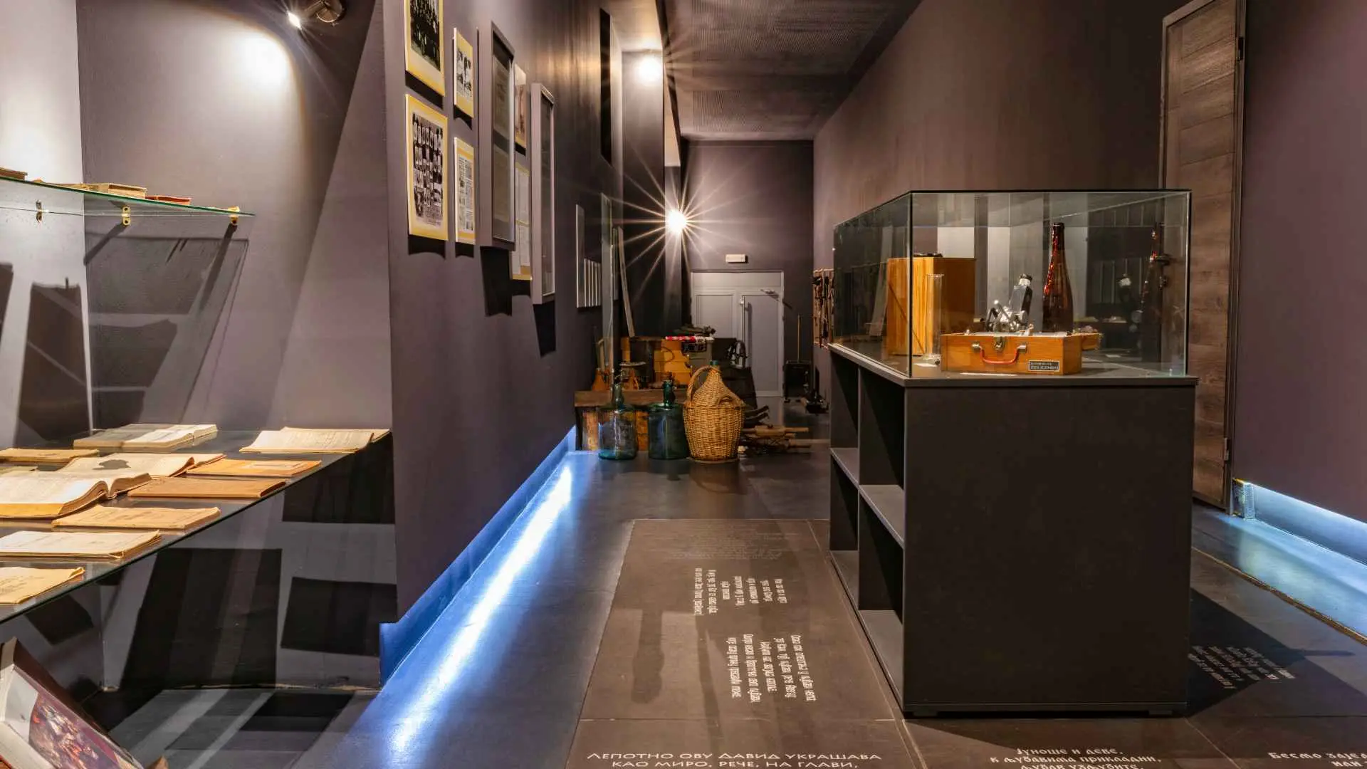 Despotika Winery interior. The items are placed inside glass containers, it appears to be a museum.