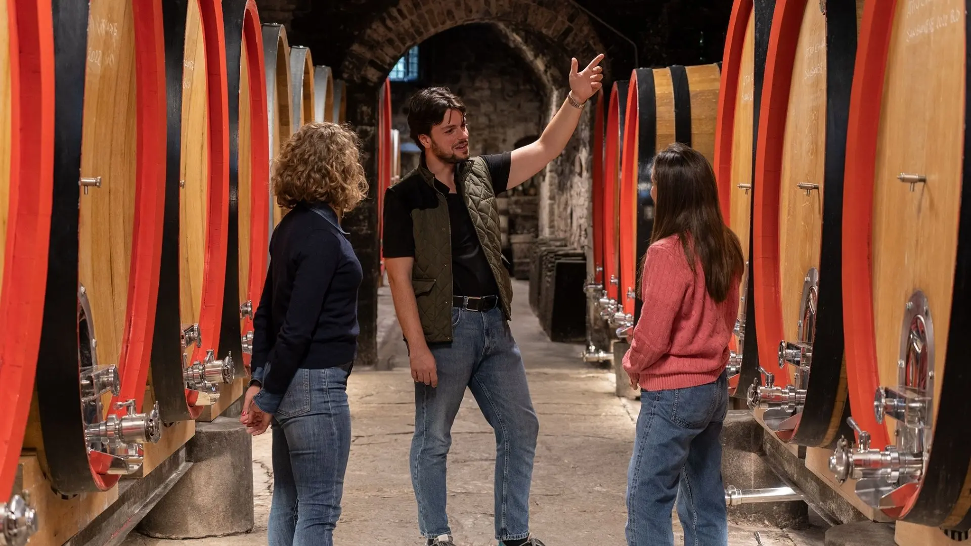 A guide talking with guests at the Castello del Trebbio winery in Tuscany.