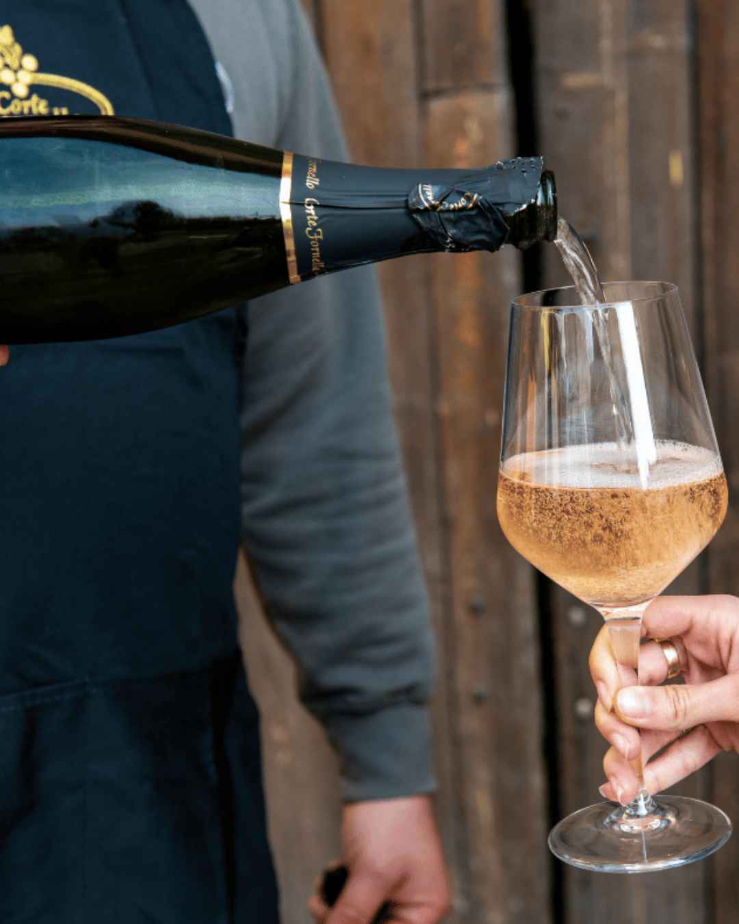 Sparkling wine Sparkling wine being poured in a glass.