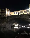 Florence Wine Boat Experience sunset Ponte Vecchio.webp